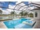 Relaxing pool area with a spa and waterfall feature with views of a beautiful lake at 8218 Genoa Blvd, Lakewood Ranch, FL 34202