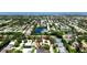 Aerial view of a peaceful neighborhood with beautiful homes, pools, and picturesque lakes at 9102 12Th Nw Ave, Bradenton, FL 34209