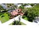 Aerial view of a lovely home with a screened-in pool and meticulously landscaped yard at 9102 12Th Nw Ave, Bradenton, FL 34209