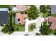 Aerial view featuring a home with a screened-in pool, beautiful landscaping, and a long driveway at 9102 12Th Nw Ave, Bradenton, FL 34209