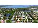 Aerial view showcasing the neighborhood's charming homes near the water, with lush greenery at 9102 12Th Nw Ave, Bradenton, FL 34209
