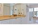 Bathroom featuring double sinks, marble countertops, and a separate shower and tub at 9102 12Th Nw Ave, Bradenton, FL 34209