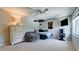 Cozy bedroom with a dresser, tv, and soft seating at 9102 12Th Nw Ave, Bradenton, FL 34209