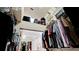Well-organized walk-in closet with upper shelves and ample hanging storage at 9102 12Th Nw Ave, Bradenton, FL 34209