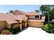 Inviting two-story home featuring a well-manicured lawn, circular driveway, mature trees and attractive front entrance at 9102 12Th Nw Ave, Bradenton, FL 34209
