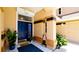 Close up of the front door with a striking blue door and inviting entryway at 9102 12Th Nw Ave, Bradenton, FL 34209