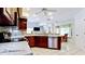Updated kitchen featuring granite countertops, stainless steel appliances, and open layout at 9102 12Th Nw Ave, Bradenton, FL 34209