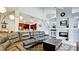 Open-concept living room showcasing a cozy fireplace, staircase, and seamless flow to the kitchen at 9102 12Th Nw Ave, Bradenton, FL 34209