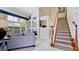 Spacious living room with fireplace and stairs leading upstairs, perfect for entertaining at 9102 12Th Nw Ave, Bradenton, FL 34209