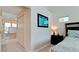 Bright bedroom featuring vaulted ceilings, ensuite bath with soaking tub, and neutral carpet at 9102 12Th Nw Ave, Bradenton, FL 34209