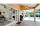 Inviting outdoor patio featuring a BBQ grill, pool access, and seamless transition to indoor spaces at 9102 12Th Nw Ave, Bradenton, FL 34209
