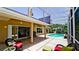 Screened in patio area with a seating, an outdoor grill and access to the pool at 9102 12Th Nw Ave, Bradenton, FL 34209