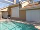 Rear view of house showing pool, patio, screen enclosure, storm doors and tile at 9102 12Th Nw Ave, Bradenton, FL 34209