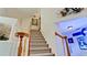 Staircase with wooden handrail leading upstairs at 9102 12Th Nw Ave, Bradenton, FL 34209