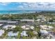 A beautiful aerial view of the neighborhood and ocean at 101 Whispering Sands Dr # 307, Sarasota, FL 34242