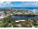 An aerial view of a neighborhood showcases the community's layout and proximity to the water at 101 Whispering Sands Dr # 307, Sarasota, FL 34242