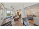 Relaxing sunroom with cozy seating, perfect for enjoying views and connecting to the indoor living spaces at 101 Whispering Sands Dr # 307, Sarasota, FL 34242