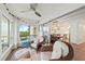 Sunroom boasts comfortable seating and serene views, connecting indoor and outdoor spaces for relaxed living at 101 Whispering Sands Dr # 307, Sarasota, FL 34242