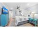 Inviting bedroom with coastal decor, bedside tables, and flat-screen TV at 101 Whispering Sands Dr # 307, Sarasota, FL 34242