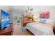 This bedroom boasts a TV, bunk beds, and outdoor access, providing entertainment and convenience at 101 Whispering Sands Dr # 307, Sarasota, FL 34242