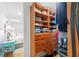 A closet featuring wooden built-ins provides an abundance of storage and organization solutions at 101 Whispering Sands Dr # 307, Sarasota, FL 34242