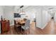 Dining area featuring a wooden table with seating for six and modern lighting fixture at 101 Whispering Sands Dr # 307, Sarasota, FL 34242