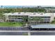 An exterior shot of the building, showcasing its architecture and surrounding landscaping at 101 Whispering Sands Dr # 307, Sarasota, FL 34242