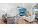 Spacious living room with bright white sofa and stylish decor creates an inviting atmosphere at 101 Whispering Sands Dr # 307, Sarasota, FL 34242