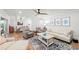 Open-concept living area with dining space, comfortable furnishings, and tasteful decor at 101 Whispering Sands Dr # 307, Sarasota, FL 34242