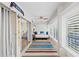 This sunroom with windows and a couch creates a serene space for relaxation and enjoyment at 101 Whispering Sands Dr # 307, Sarasota, FL 34242