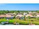 Aerial view of the property with a canal front backyard, private dock, pool, and surrounding community at 105 Inlets Blvd # 105, Nokomis, FL 34275