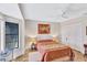Cozy bedroom with soft lighting, art, and a built-in closet at 105 Inlets Blvd # 105, Nokomis, FL 34275