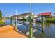 Boatlift on the canal, offering convenient and secure storage for your boat with easy access to the water at 105 Inlets Blvd # 105, Nokomis, FL 34275