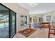 Elegant dining room with access to the outdoor pool area, offering seamless indoor-outdoor living at 105 Inlets Blvd # 105, Nokomis, FL 34275