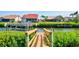 Wooden dock featuring access to a waterfront canal, perfect for boating and enjoying the coastal lifestyle at 105 Inlets Blvd # 105, Nokomis, FL 34275