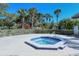 Cozy hot tub area, perfect for relaxing and unwinding, surrounded by tropical landscaping and privacy hedges at 105 Inlets Blvd # 105, Nokomis, FL 34275