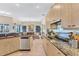 Modern kitchen with stainless steel appliances and granite countertops at 105 Inlets Blvd # 105, Nokomis, FL 34275