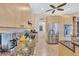 Kitchen featuring granite countertops, stainless steel appliances, and wooden cabinetry at 105 Inlets Blvd # 105, Nokomis, FL 34275