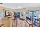 Spacious living area connected to kitchen and dining room with sliding glass doors to the patio at 105 Inlets Blvd # 105, Nokomis, FL 34275