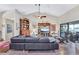 Spacious living room with vaulted ceilings and an inviting view of the outdoor living space at 105 Inlets Blvd # 105, Nokomis, FL 34275