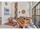 Cozy living room with a piano, stylish decor, and a large window providing ample natural light at 105 Inlets Blvd # 105, Nokomis, FL 34275