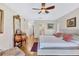 Bright bedroom with an ensuite bath, featuring decorative furniture and decor at 105 Inlets Blvd # 105, Nokomis, FL 34275
