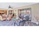 Patio with dining area and outdoor furniture that overlooks the pool at 105 Inlets Blvd # 105, Nokomis, FL 34275