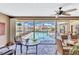 Relaxing outdoor patio with comfortable seating and tranquil views of the pool at 105 Inlets Blvd # 105, Nokomis, FL 34275