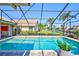 A sparkling screened pool offers scenic views of the lush backyard landscaping and neighborhood at 105 Inlets Blvd # 105, Nokomis, FL 34275
