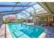 The screened-in pool is perfect for enjoying the outdoors in privacy and comfort at 105 Inlets Blvd # 105, Nokomis, FL 34275