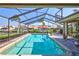 Sparkling screened-in pool offers stunning views of the surrounding waterfront community at 105 Inlets Blvd # 105, Nokomis, FL 34275