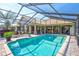 Private backyard featuring a sparkling pool and a covered patio area perfect for outdoor enjoyment at 105 Inlets Blvd # 105, Nokomis, FL 34275