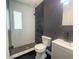 Contemporary bathroom with a tiled shower, modern toilet, and sleek vanity at 115 41St Ne Ave, St Petersburg, FL 33703