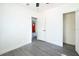 A clean, white bedroom featuring modern gray wood floors and a bright, minimalist aesthetic at 115 41St Ne Ave, St Petersburg, FL 33703